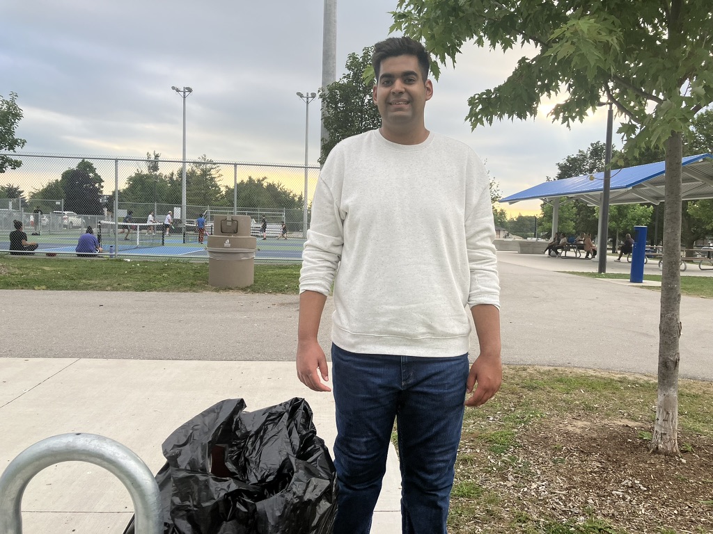 Asmar Naveed at a Ward 9 park after a neighbourhood cleanup